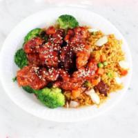 S5. Sesame Chicken Special · Chunks of chicken with brown sauce and broccoli with sesame seeds on the top.