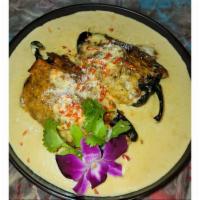 Stuffed Poblano Peppers · Roasted Poblano Peppers Stuffed with Porn Wrapped in Melted Cheese served in a Roasted Corn ...