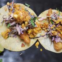 Fish Taco · Battered and Fried Fish Topped with Chipotle Slaw, Mango Pineapple, Pico, Raw Onion and Cila...