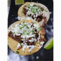 Birria Taco · Braised Birria, Metled Oaxaca Cheese, Topped with Onions and Cilantro. Served with side of C...