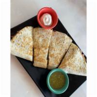 Steak Quesadilla · Grilled steak, melted cheese, served with red salsa, guacamole and sour cream