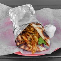 Chicken Shawarma Wrap · Grilled boneless chicken tenderloin stuffed inside freshly made naan bread, romaine lettuce,...