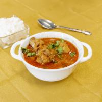 Chicken Curry · Sauce with yogurt, tomatoes, onion, garlic and ginger in this spicy Indian dish.