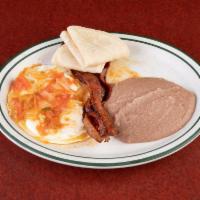 Huevos Rancheros Breakfast · Your choice of eggs with ranchero sauce,served with refried beans and your choice of tortilla