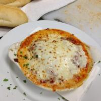 Eggplant Rollatini · Eggplant stuffed with spinach and ricotta topped with mozzarella.