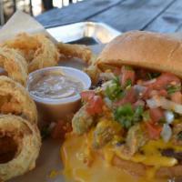 Jalapeno Burger · Large beef burger patty seasoned and grilled. Fried jalapenos, pico de gallo, chili con ques...