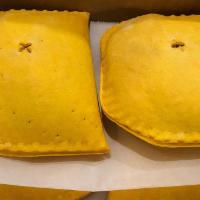 Jamaican Style Meat Pie (Box of 4) · One box of four meat pastries filled with seasoned ground beef, thyme, mild hot peppers, and...