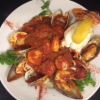 Fruit of the Sea · Shrimp, scallops, clams, mussels & a 5oz lobter tail in our homemade marinara over linguini.