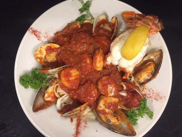 Fruit of the Sea · Shrimp, scallops, clams, mussels & a 5oz lobter tail in our homemade marinara over linguini.