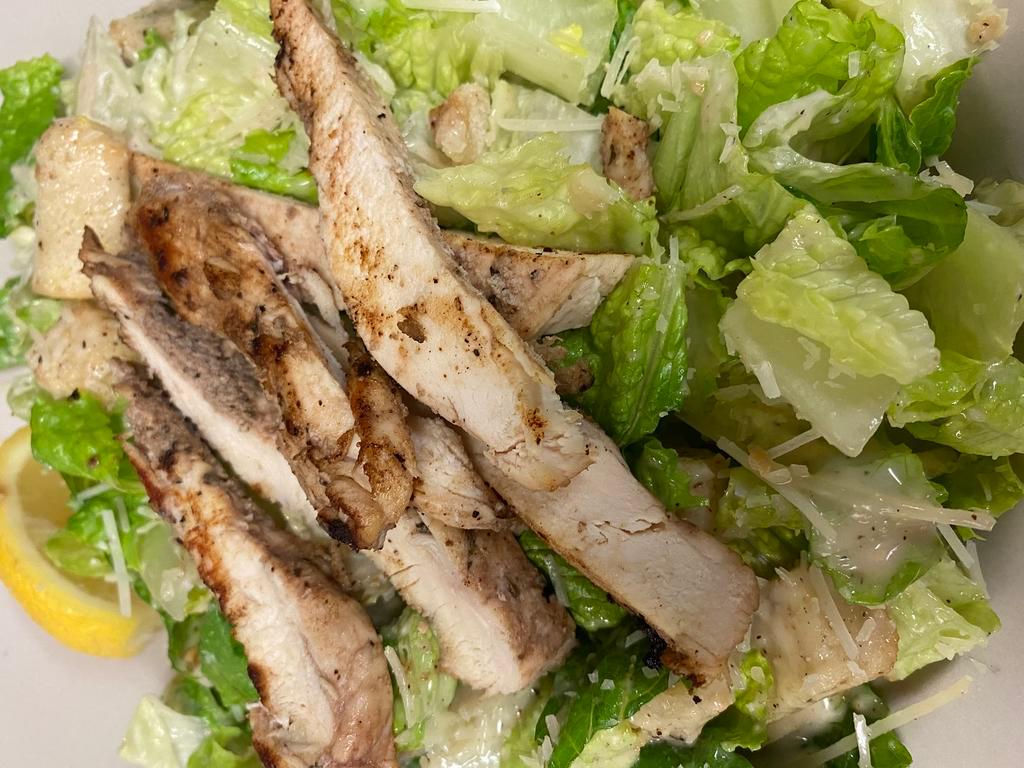 Chicken Caesar Salad · Grilled chicken, croutons on a bed of romaine & topped with parmesan cheese with Caesar dressing