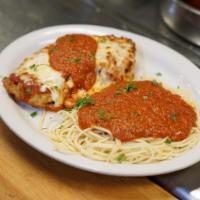 Chicken Parmesan · Breaded chicken cutlet baked with our house sauce and mozzarella. Choice of side dish.