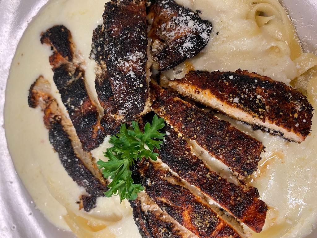 Blackened Chicken Alfredo · chicken blackened with our special seasoning over fettuccini in our homemade alfredo sauce!