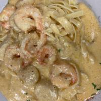 Black and Blue Shrimp and Scallops · Shrimp and scallops tossed in a Cajun, bleu cheese Alfredo over fettuccini.