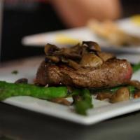 10 oz. Sirloin · Served with mushrooms and asparagus. Choice of a side.