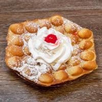The Original Bubble Waffle · Topped with powdered sugar, whipped cream and cherry.
