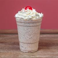 Reese's Butter Cup Ice Cream Malt · Ice cream malt made with Reeses pieces, topped with whipped cream and cherry.