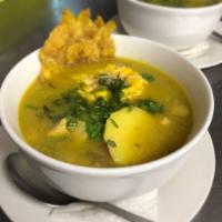 Sopa de Tostones con chuleta Empanizada · Green Plantain soup with Breaded Pork loin rice, salad and sweet  plantain.