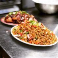 House Special Fried Rice · Pieces of chicken, shrimp, pork, beef mixed into the rice.