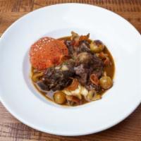 Coq Au Vin · A classic French dish of Burgundy braised chicken with pancetta, mushrooms, and pearl onions...