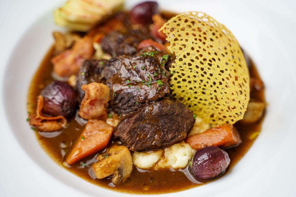 Beef Bourguignon · Slow-cooked beef in a red wine sauce  with pearl onions & cripsy bacons . Served on homemade mashed potato