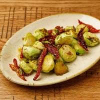 Brussel Sprouts · Sauteed with sun dried tomatoes ,garlic & butter &herbs
