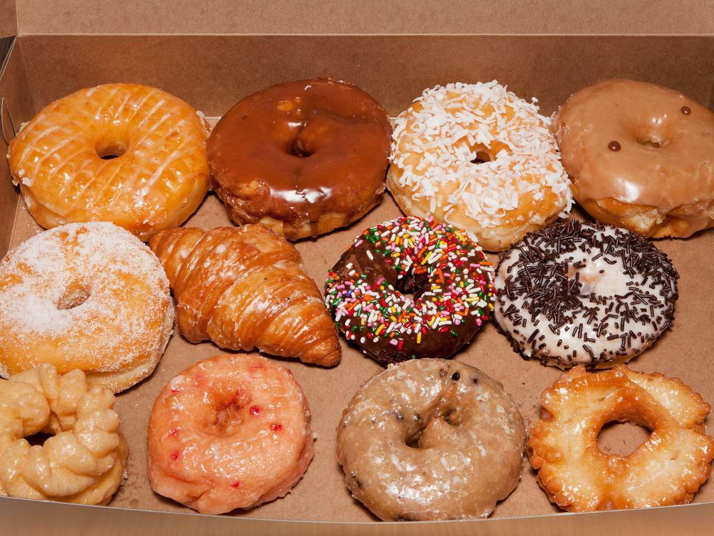 Mix Dozen Donuts · Any filling or big donut included(Apple frilter, Cinamonroll, Apple Bear Claw Chocolate Chip Donut) dozen will be add more (filling add 50cents for each, big donut $1.50 more for each)
