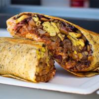 The G.O.A.T. Breakfast Burrito · Eggs, thick cut bacon, potatoes, locally sourced, handmade chorizo, shredded cheese, sour cr...