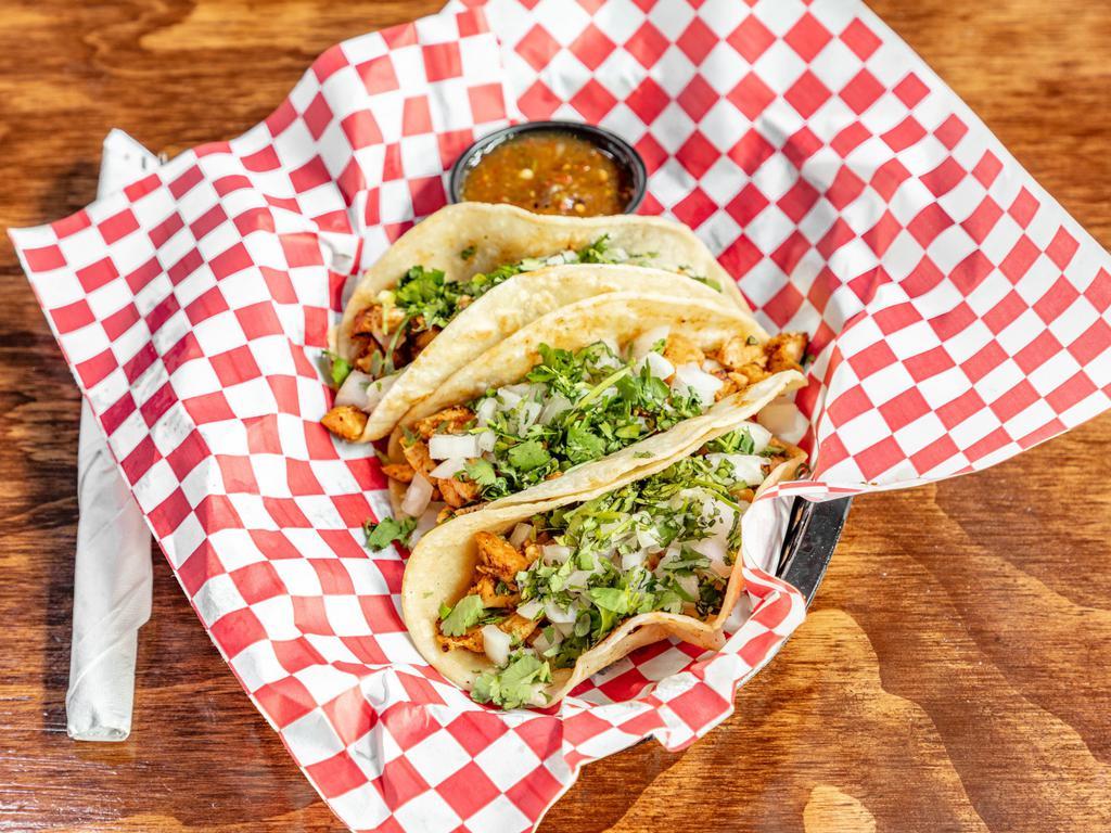 Street Tacos · 3 soft corn tortillas topped with lime, diced onions and cilantro. Served with roasted tomato salsa.