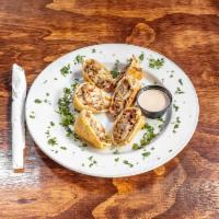Philly Cheese Steak Egg Rolls · Thinly sliced steak with grilled onions, bell peppers and melted provolone cheese, wrapped u...