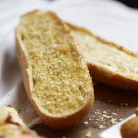 Cheese Garlic Bread · Served with garlic butter, pizza sauce and seasoning.