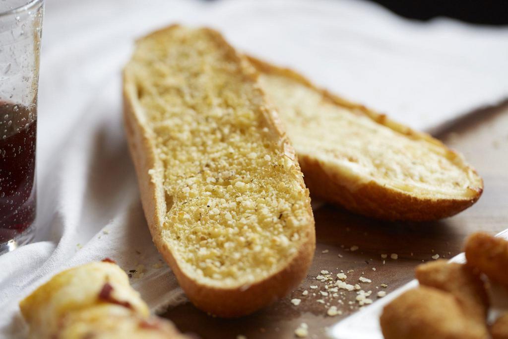 Garlic Bread · Served with garlic butter, pizza sauce and seasoning.