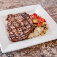 Drix Ribeye · 12 oz. USDA choice ribeye seasoned and chargrilled to your preference. Served the red wine b...