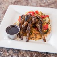 New Zealand Lamb Chops · Perfectly seasoned and cooked to temperature served with our red wine blueberry reduction sa...