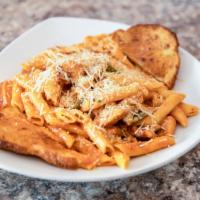 Alla Vodka Pasta · Penne pasta tossed in a creamy tomato-based sauce with peppers and a kick of cayenne pepper ...