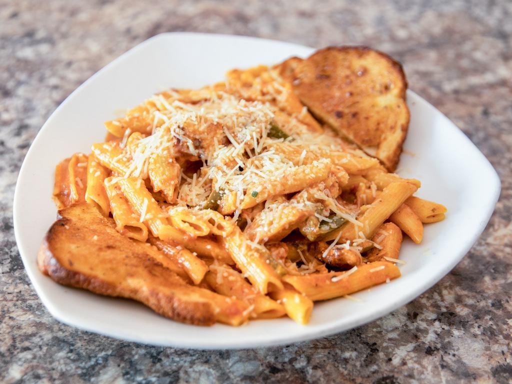 Alla Vodka Pasta · Penne pasta tossed in a creamy tomato-based sauce with peppers and a kick of cayenne pepper topped with Parmesan cheese.