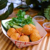 Fried Fish Balls · 7 pieces. Thai’s favorite street snack, fried fish balls served with sweet chili sauce.