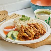 Crispy Chicken Over Ginger Rice · Crispy chicken over ginger rice served with cucumber, cilantro, sweet chili sauce and chicke...