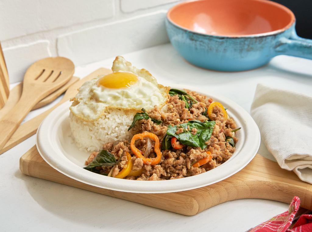 Minced Chicken Basil over Rice · Minced chicken stir-fried with spicy chili, basil, onion, bell pepper served over rice and topped with sunny side up.