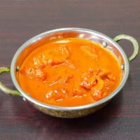 Chicken Tikka Masala · Clay oven cooked white meat chicken simmered in a tomato awl on sauce.