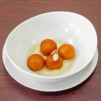 2 Gulab Jamun · Deep fried cheese balls in a honey syrup.