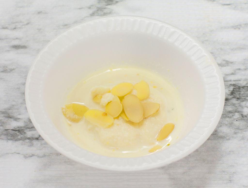 Rasmalai · Sweet cottage cheese dumpling flavoured with cardamon and rose water in a cream milk sauce.