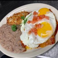 Breakfast Enchiladas  · 2 chicken or ground beef in guajillo red sauce, with 2 fried eggs on top, melted cheddar che...