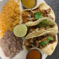 Dorado Tacos  · Three carnitas tacos mixed with grilled serrano, eldorado suace, sprinkled with hashbrowns ,...