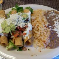 Flautas  · Three crispy chicken or beef flautas, cabbage and fresh tomatoes on top, cheese, sour cream ...