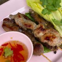 Moo Ping · Grill marinated pork, the ultimate street food on a stick! 