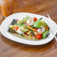 Yum Avocado  · Avocado with sweet corn tossed with shrimp, tomatoes in flavorful spicy Thai lime dressing. ...