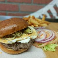 Mexican Burger · Queso blanco, guacamole, fried egg, jalapeno, lettuce, tomato, onion, chipotle mayo.