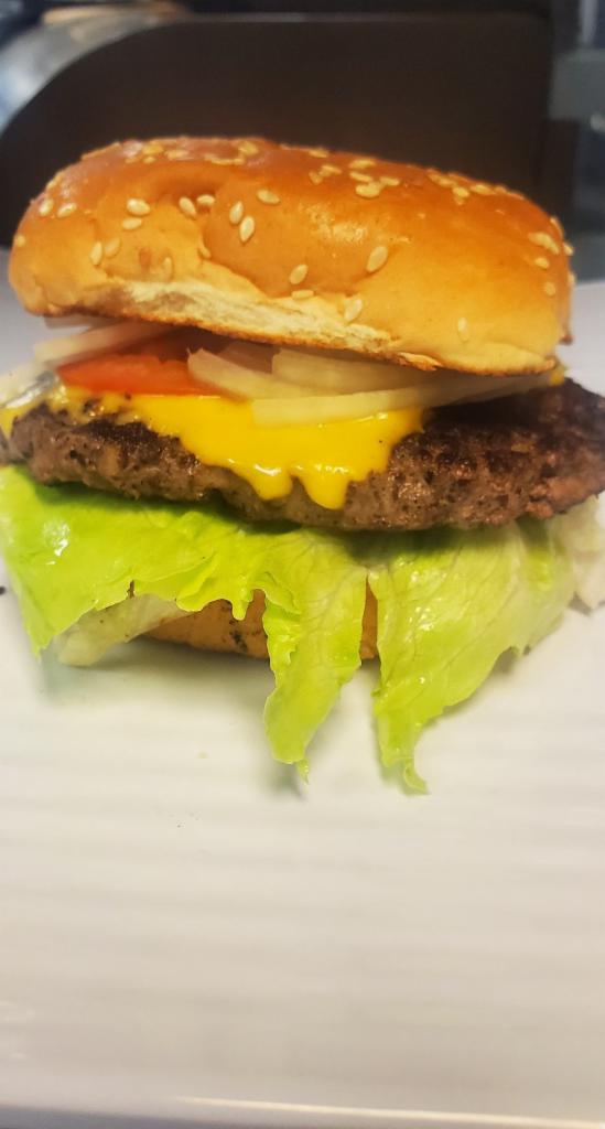 Classic Hamburger Sandwich · Classic Hamburger in a Bun comes with cheese, onion, latus, tomato & Ketchup & Mayonnaise