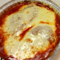 Chicken Parmigiana · Breaded chicken pan fried to a crispy golden brown topped with melted mozzarella served over...