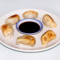 102. Pot Stickers · 6 pieces. Seared dumplings filled with pork and vegetables.